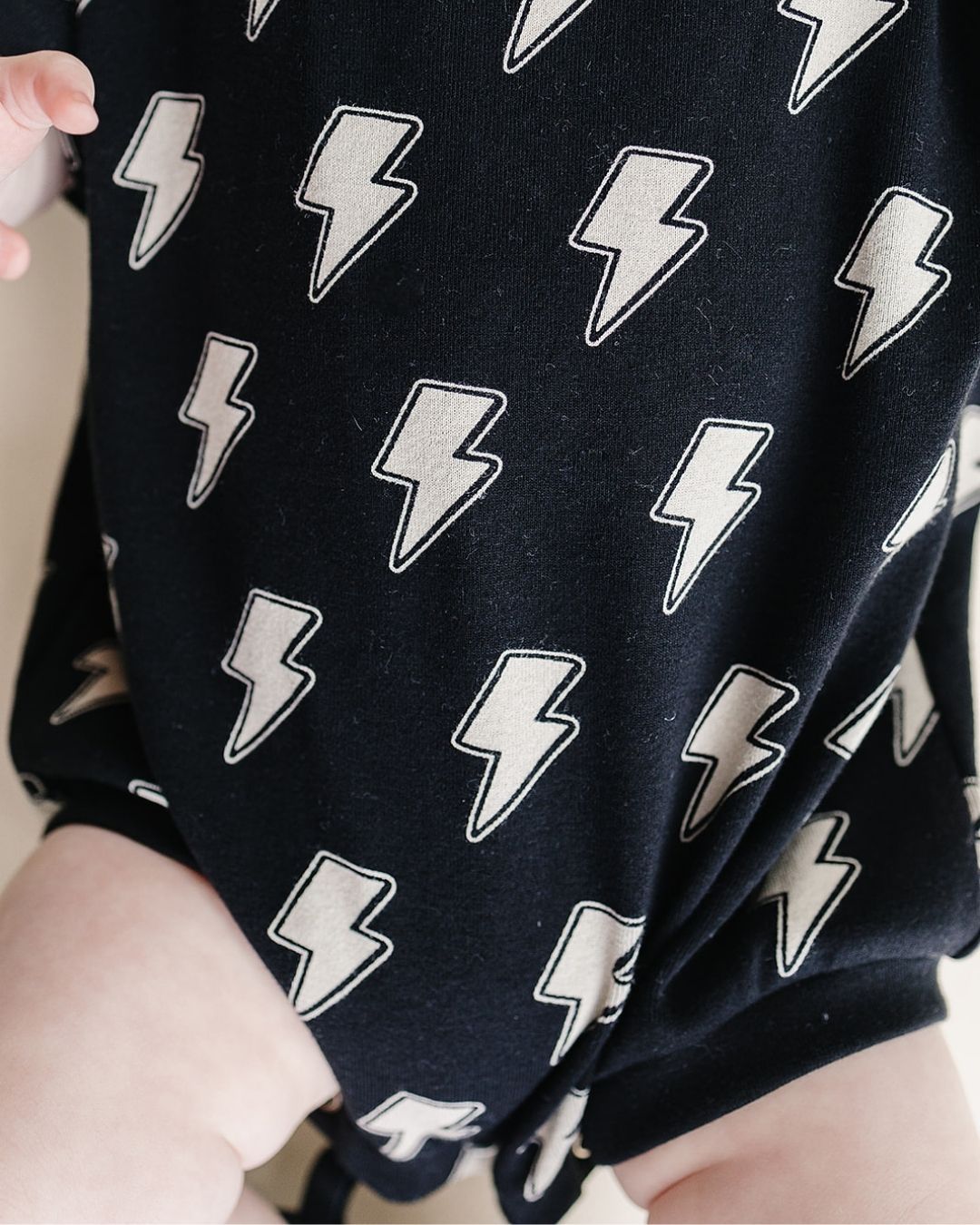Short Sleeve Bubble Romper | Black Bolts - HoneyBug
